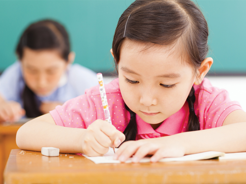 kids writing in school