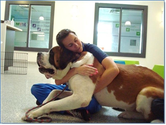 woman hugging large dog