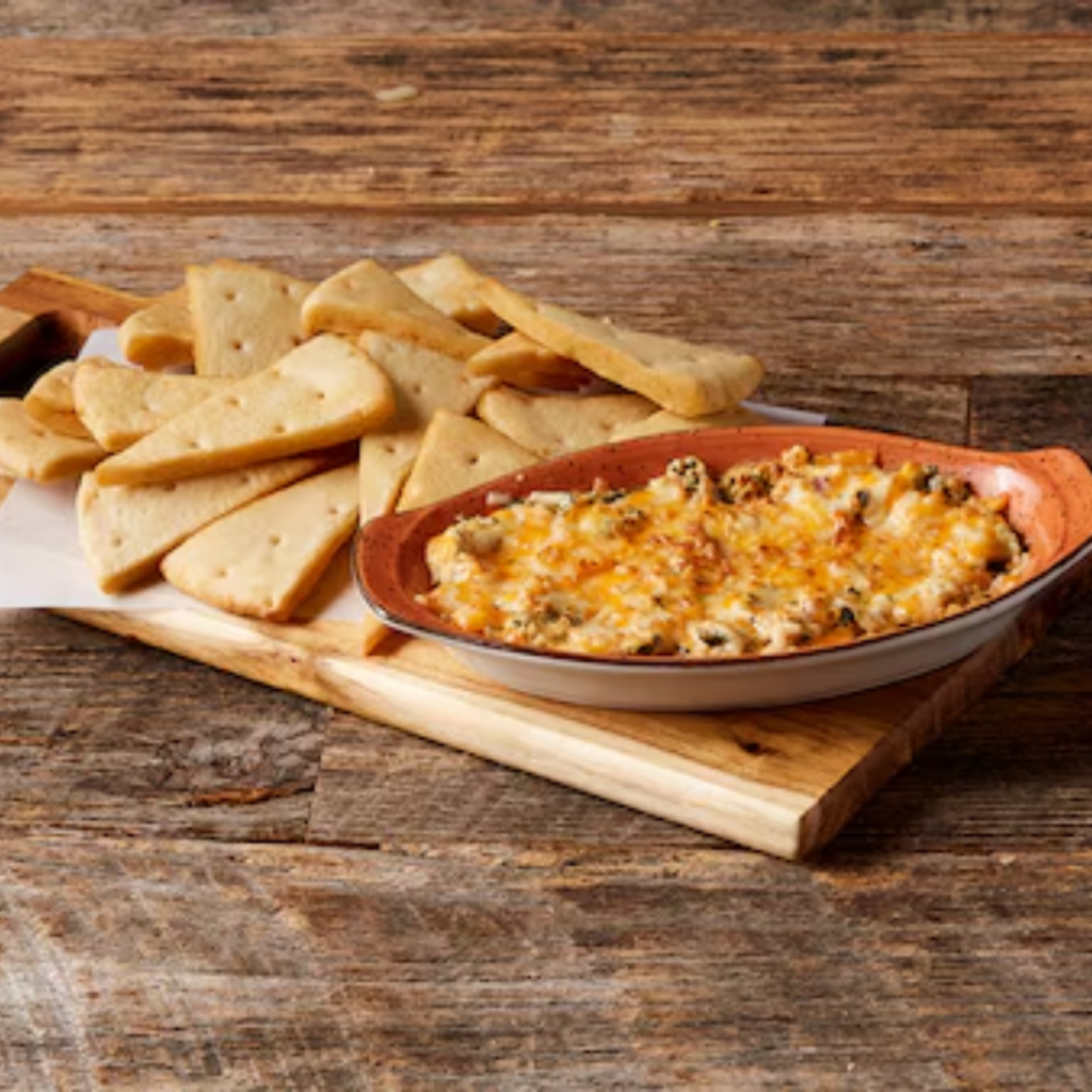 image of spinach dip with pita bread on the side from Kelsey's Roadhouse.